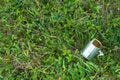 Empty tin can on the grass, human negligence Royalty Free Stock Photo