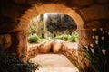 Empty tomb carved out of rock in a beautiful garden Royalty Free Stock Photo