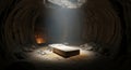 Empty tomb in a dark cave with bright light on a stone slab and a candle. Religious Easter concept, resurrection image. Royalty Free Stock Photo