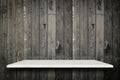 Empty top of natural stone shelves and wooden wall background