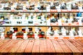 Empty top of wood table with blur camera shop.