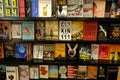 Empty top of wood table with blurred many books on bookshelf in library background