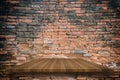 Empty top of wooden shelves on ancient old red brick wall background, For product display.