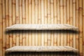 Empty top wooden shelves and bamboo wall background Royalty Free Stock Photo