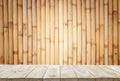 Empty top wooden shelves and bamboo wall background Royalty Free Stock Photo