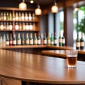 Empty the top of wooden table with blurred counter bar and bottles Background Royalty Free Stock Photo