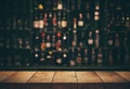 Empty the top of wooden table with blurred counter bar and bottles Royalty Free Stock Photo
