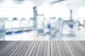 Empty top of wooden table and blurred of fitness gym background