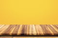 Empty top of wooden table on yellow background. Royalty Free Stock Photo