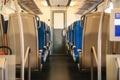 Empty train interior. Corridor and a lot of seats. Royalty Free Stock Photo