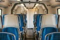 Empty train interior. Corridor and a lot of seats. Royalty Free Stock Photo