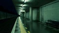 Empty train station platform at night with lights Royalty Free Stock Photo