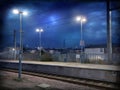 Empty train station platform at night under starry sky Royalty Free Stock Photo