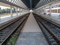 Empty train station. A platform under a glass roof Royalty Free Stock Photo