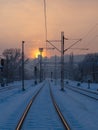 Empty train tracks at sunset - winter season Royalty Free Stock Photo