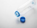 Empty Plastic Water Bottle with Blue Cap on White Background Royalty Free Stock Photo