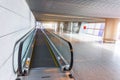 An empty travelator in the terminal of the airport for an accelerated transfer of passengers, passenger corridor