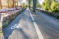 Empty tree lined cycle and pedestrian path running on the bak of river on a sunny spring day Royalty Free Stock Photo