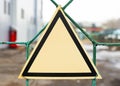 An empty triangular warning sign