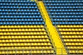 Blue and yellow empty stadium seats Royalty Free Stock Photo