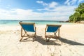 Empty tropical beach landscape. Travel vacations destination. Sunbeds on the sand. Tourism