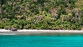Empty tropical beach and lush green vegetation