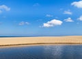Empty tropical beach and sea with white cloud and blue sky background Royalty Free Stock Photo