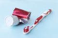 Empty tube of toothpaste and Toothbrush on blue background Royalty Free Stock Photo