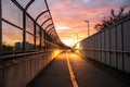Empty tunnel with footpath lit by sunset Royalty Free Stock Photo