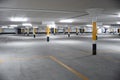 Empty underground car parking lot in Europe. Wide-angle view, neon lights, no people Royalty Free Stock Photo