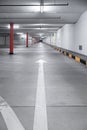 Empty underground car parking lot in Europe. Wide-angle view, neon lights, no people Royalty Free Stock Photo