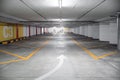 Empty underground car parking lot in Europe. Wide-angle view, neon lights, no people Royalty Free Stock Photo