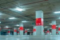 Empty underground car parking lot. Underground car parking garage at shopping mall or international airport. Indoor parking area. Royalty Free Stock Photo