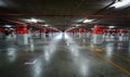 Empty underground car parking lot. Underground car parking garage at shopping mall or international airport. Indoor parking area. Royalty Free Stock Photo