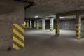 Empty underground parking lot or garage interior with concrete stripe painted columns Royalty Free Stock Photo