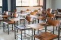 Empty university classroom with many wooden chairs. Wooden chairs well arranged in college classroom. Empty classroom with vintage Royalty Free Stock Photo