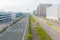 Empty urban road with a lot of car in car park.