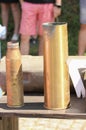 empty, used ammunition cases on the table.