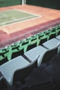 Empty vacant small stadium seats outdoors, bleachers, nobody, no people, cancelled sports event, nobody present at a sport show