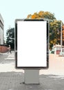 Empty mock-up of a vertical billboard street poster in the background of the city Royalty Free Stock Photo