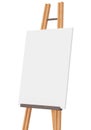 Empty vertical canvas on wooden easel, isolated on white background. Free, copy space for your picture. Artwork