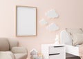 Empty vertical picture frame hanging on the wall in modern child room. Frame mock up in contemporary style. Free, copy Royalty Free Stock Photo