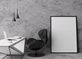 Empty vertical picture frame standing on concrete floor in modern home office. Mock up interior in minimalist Royalty Free Stock Photo