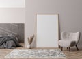 Empty vertical picture frame standing on parquet floor in modern bedroom. Mock up interior in contemporary style. Free Royalty Free Stock Photo