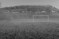 Empty village football field, small amount of fog drifting through