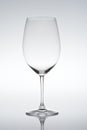 Empty vine glass on gradient background Royalty Free Stock Photo