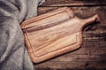 Empty vintage cutting board on old wooden Royalty Free Stock Photo