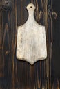 Empty vintage cutting board on wooden background Royalty Free Stock Photo