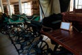 Empty vintage horse carriages parked in garage