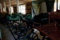 Empty vintage horse carriages parked in garage